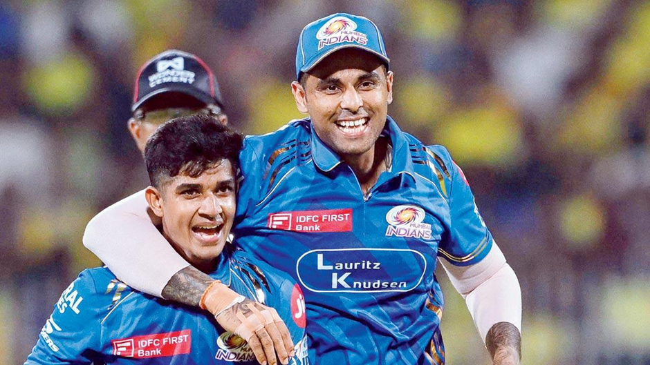 Suryakumar Yadav celebrates a wicket with Vignesh Puthur