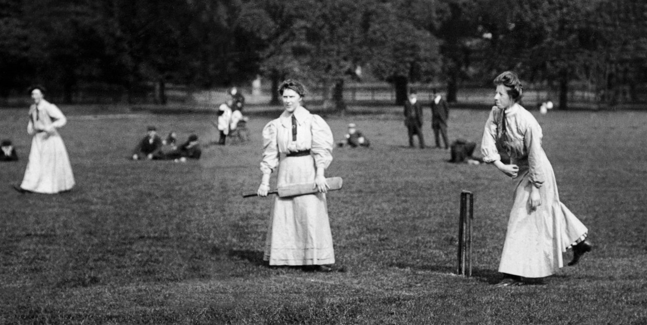 Women play a game of cricket in the 1900s